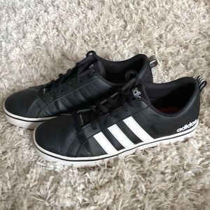 Black adidas sneakers worn in very good condition.